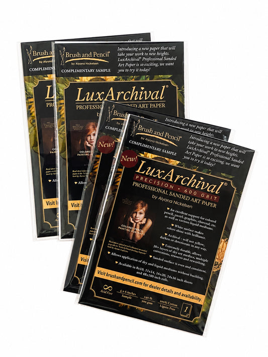 Four complimentary LuxArchival® 400 and 600 grit sanded art paper samples arranged on a white background.